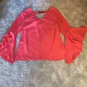 Coral top with ruffle sleeves